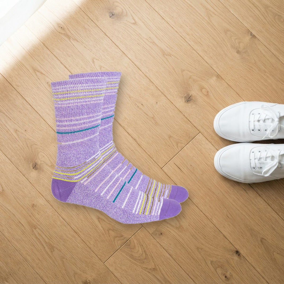 Mi Socks Purple Stripes non-binding diabetic socks on a wood floor next to white sneakers